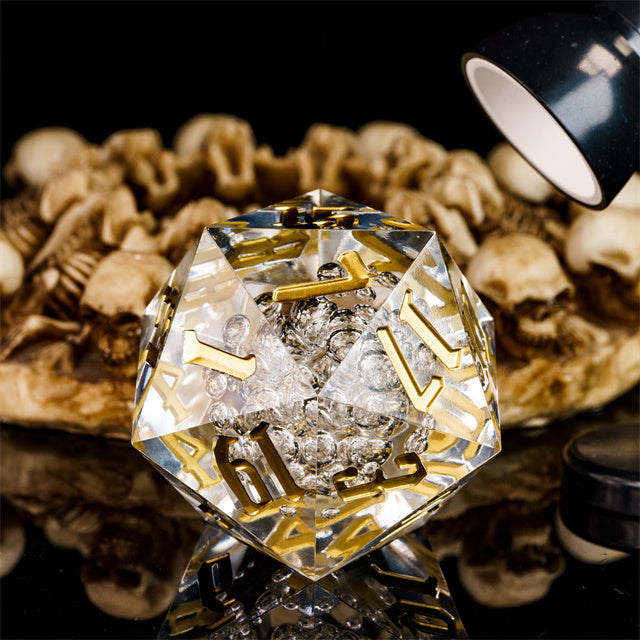 Giant 55mm D20 - Clear Bubbles - Clear acrylic giant 55mm D20 die with gold numbers and bubble inclusions inside.