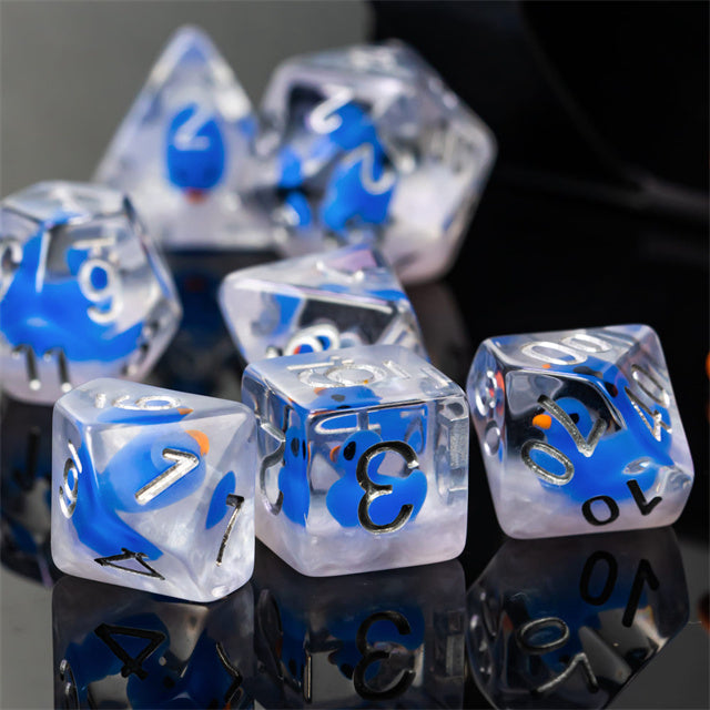 Blue Duck Dice Set - Clear dice with embedded blue duck shapes and black numbering on a reflective surface.