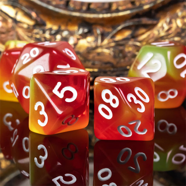 Orange & Yellow Transparent Dice - Transparent acrylic dice with a blend of orange and yellow hues, white numbers, multi-sided shapes.