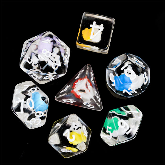 Snail Dice Set - Clear polyhedral dice set with colorful snail illustrations inside each die on black background.