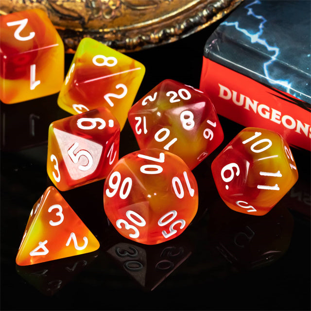 Orange & Yellow Transparent Dice - Set of seven translucent orange and yellow acrylic dice with white numbers, including d4, d6, d8, d10, d12, and d20 shapes.