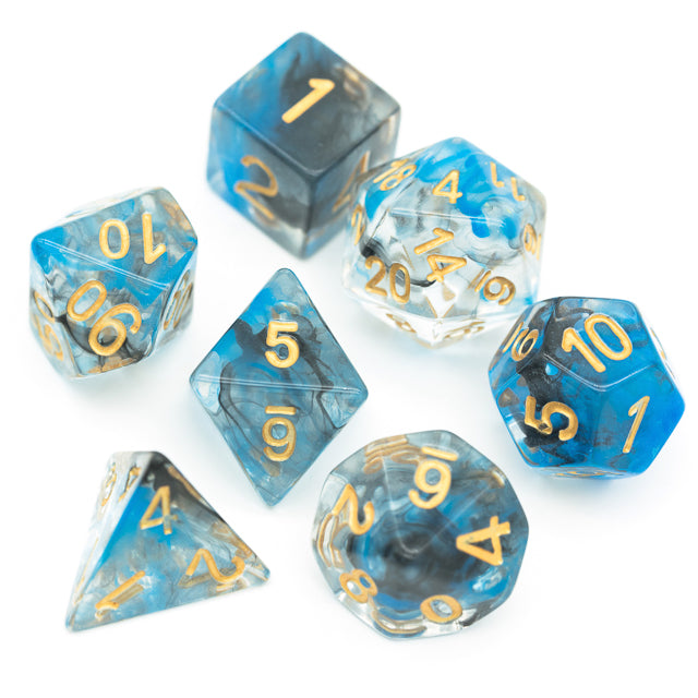 Blue & Black Smoke Dice Set - Seven polyhedral dice in translucent blue and black smoke with gold numbers, including D20, D12, D10, D8, D6, D4, and.