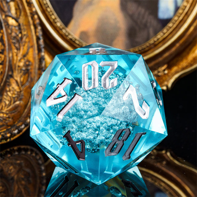 Giant 55mm D20 - Blue Bubbles - Giant 55mm transparent blue acrylic d20 dice with silver numbers and bubble texture inside.