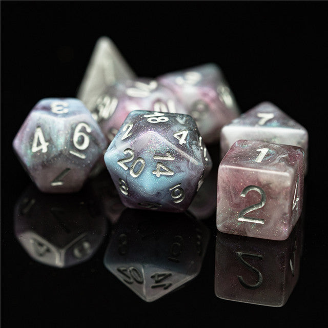 Pink & Blue Galaxy Glitter Dice Set - Pink and blue galaxy glitter RPG dice set with white numbering on glossy surface.