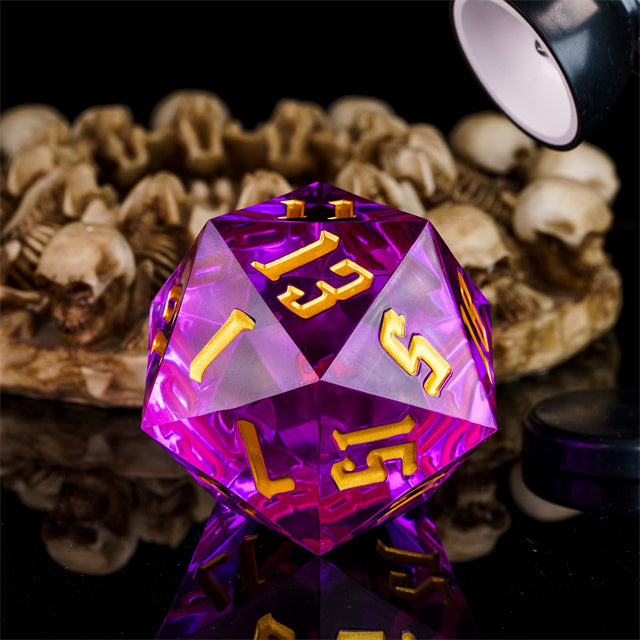 Giant 55mm D20 - Purple - Large 55mm purple acrylic 20-sided die with gold numbers, reflecting light on a black surface.
