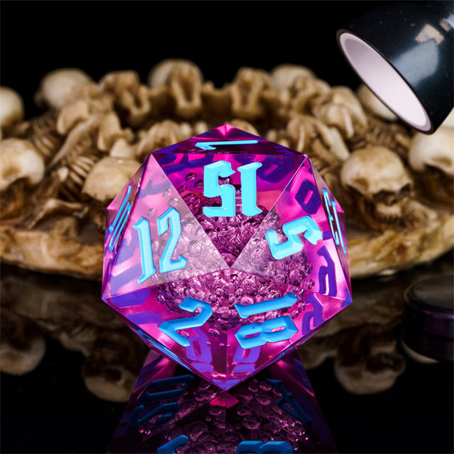 Giant 55mm D20 - Pink Bubbles - Giant 55mm transparent pink acrylic 20-sided dice with light blue numbering on black reflective surface.