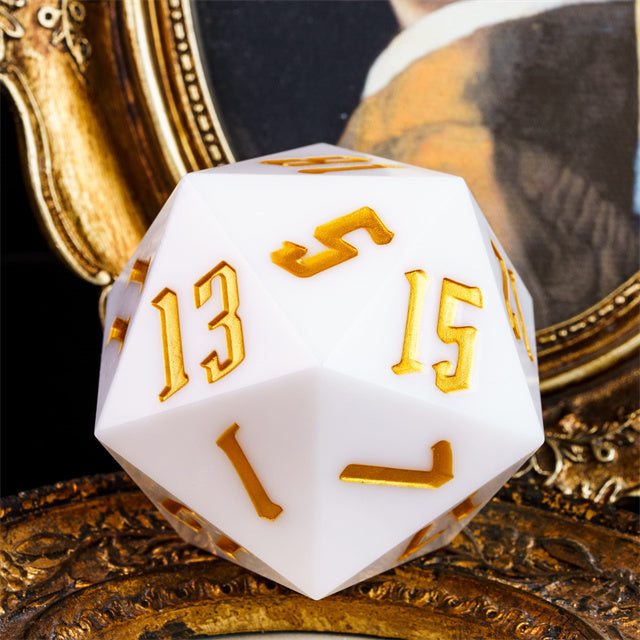 Giant 55mm D20 - White - White 55mm giant acrylic 20-sided die with gold embossed numbers.