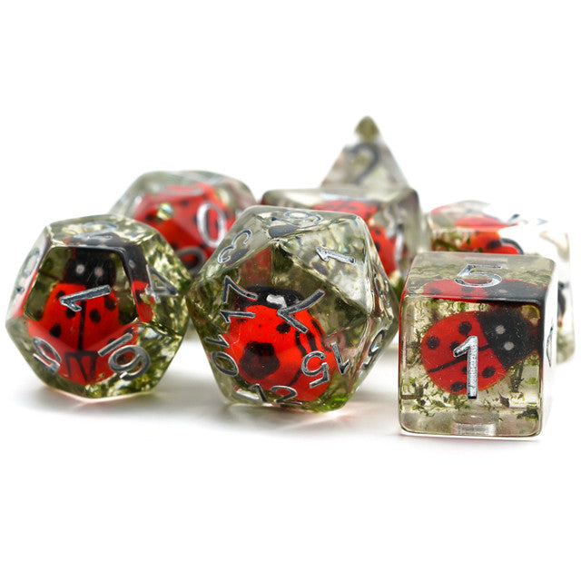 Ladybug Dice Set - Transparent polyhedral dice set with red and black ladybug designs inside each die, featuring silver glitter accents.