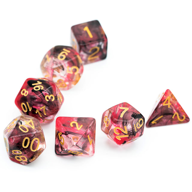 Pink & Black Smoke Dice Set - Seven polyhedral dice with pink and black smoke patterns and gold numbers.