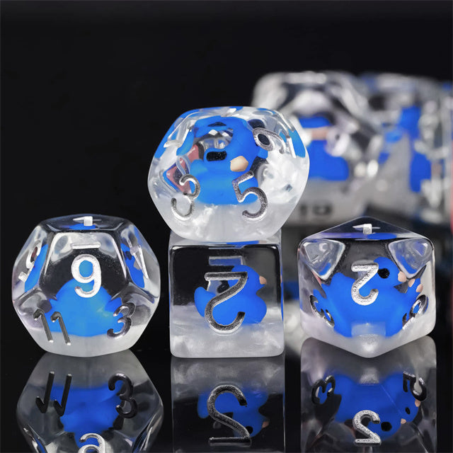 Blue Duck Dice Set - Clear dice with blue duck shapes inside and white numbers on each face, set of four.