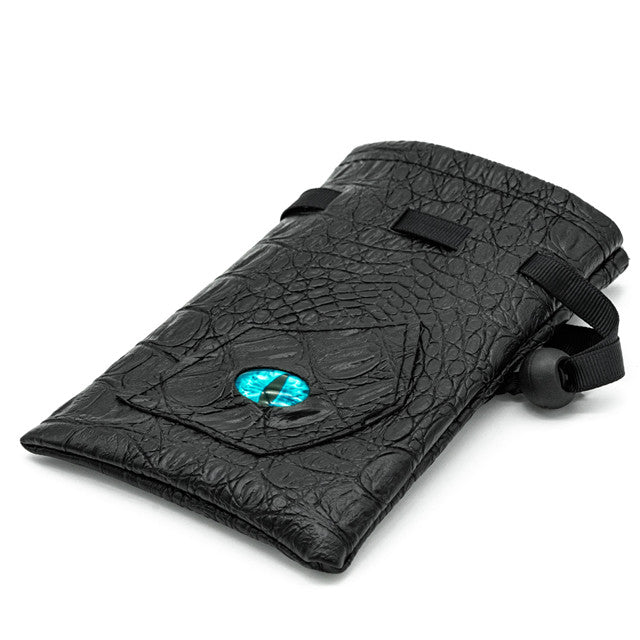 Mimic Dice Bag - Black faux leather dice bag with textured surface and blue gemstone clasp on front flap.