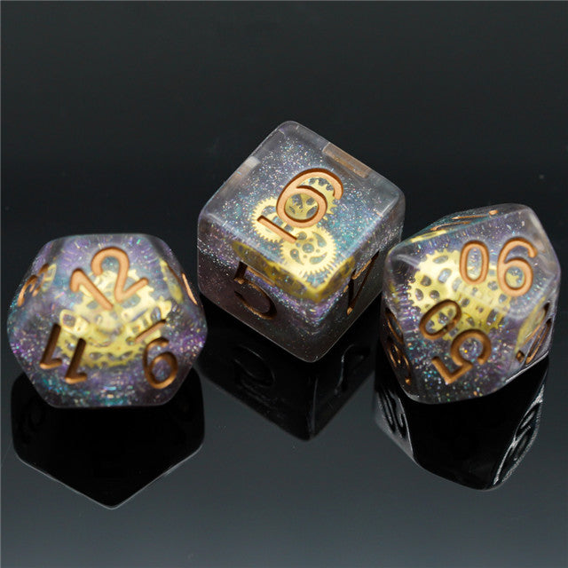 Mini Gears Dice Set - Set of three mini polyhedral dice with metallic gold numbers and a glittery purple-blue finish.