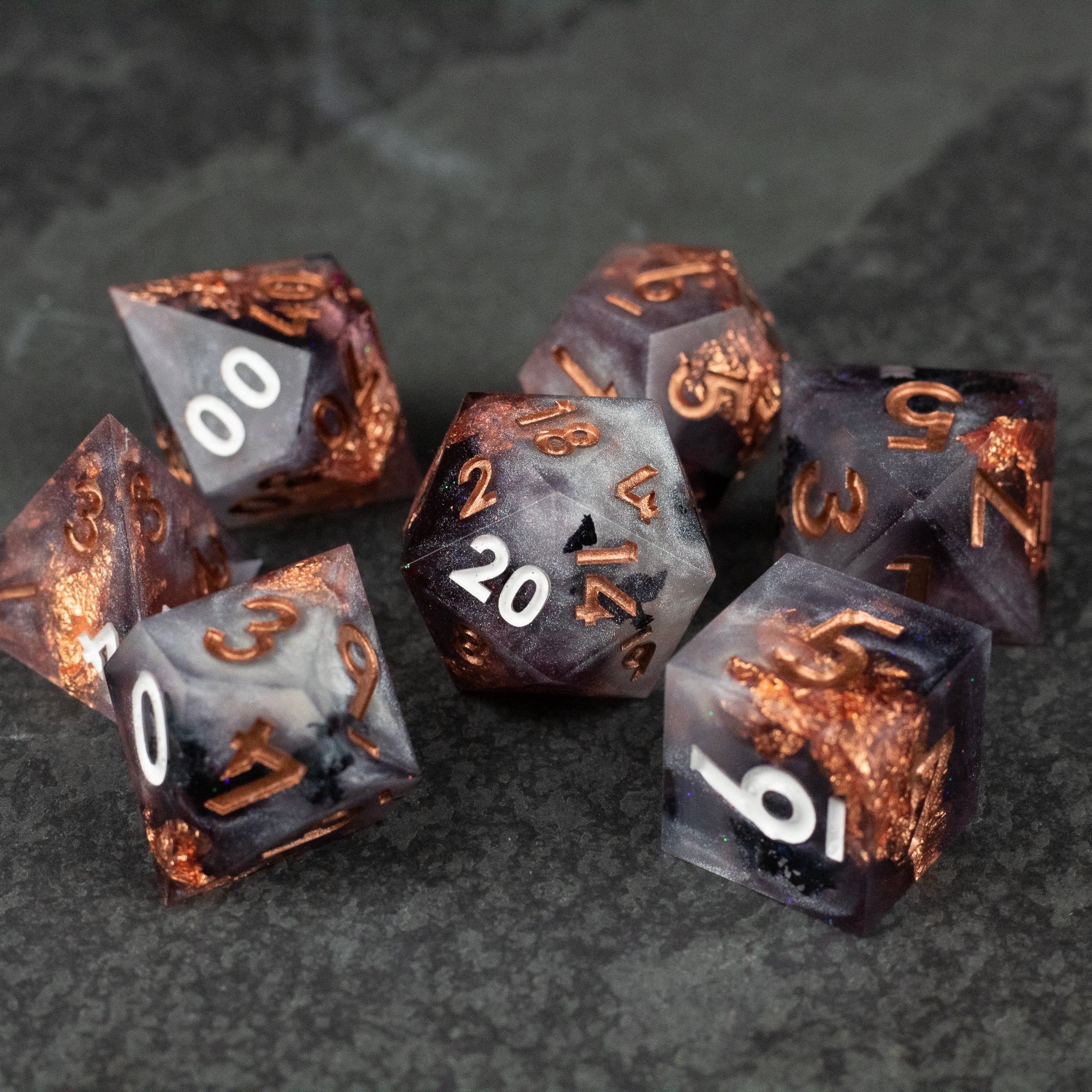 Lich King Dice Set - Set of seven sharp-edged polyhedral dice in black and copper with metallic swirls and white numbers.