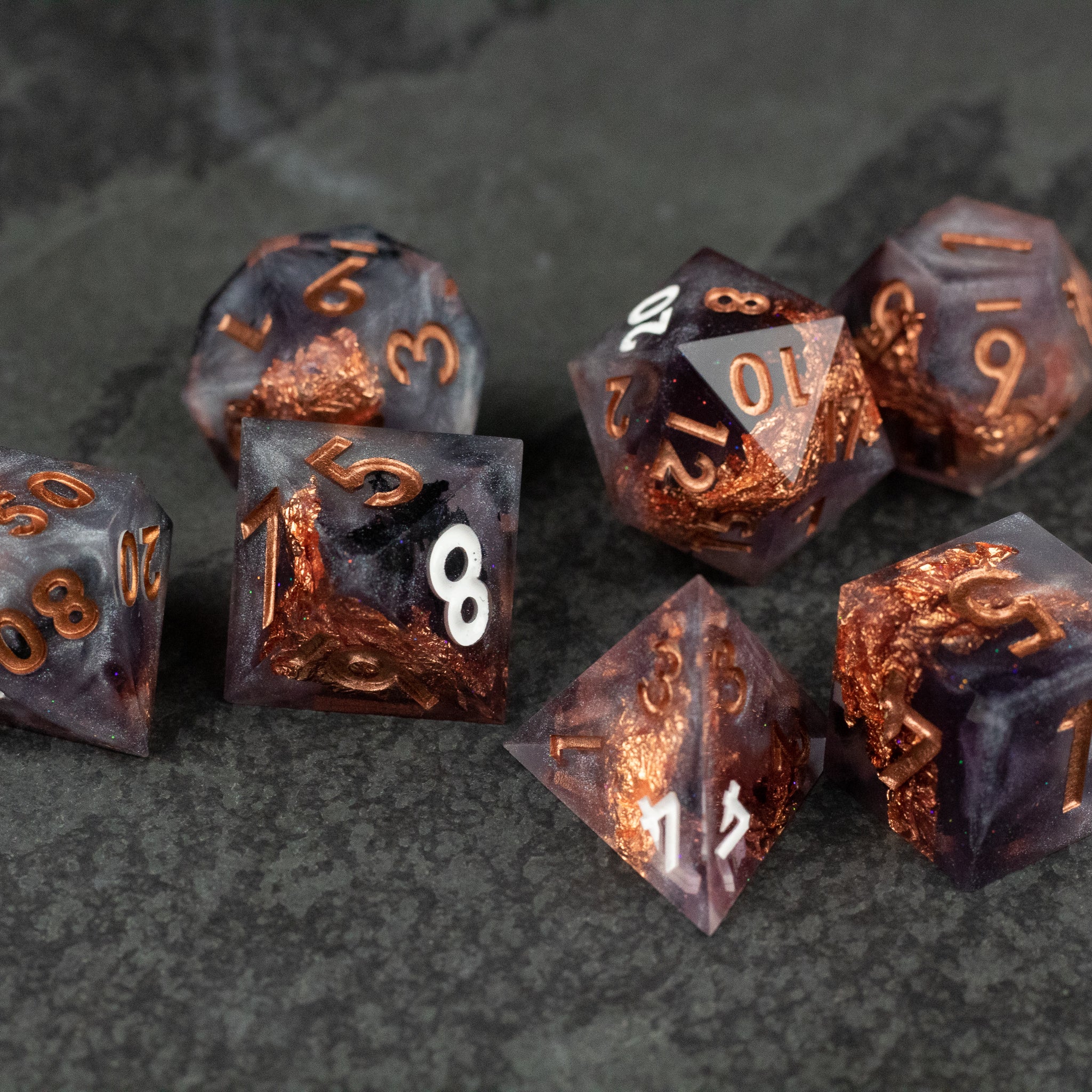 Lich King Dice Set - Black and copper metallic sharp-edged polyhedral dice set with gold numbering.