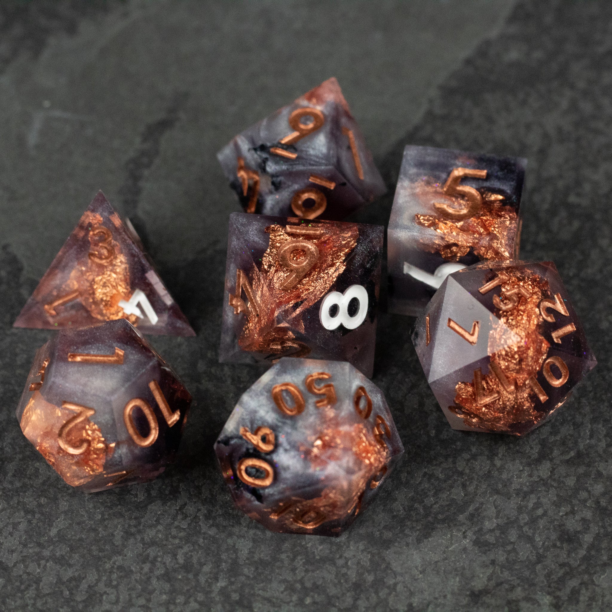 Lich King Dice Set - Black and copper sharp-edged polyhedral dice set with metallic copper numbering.