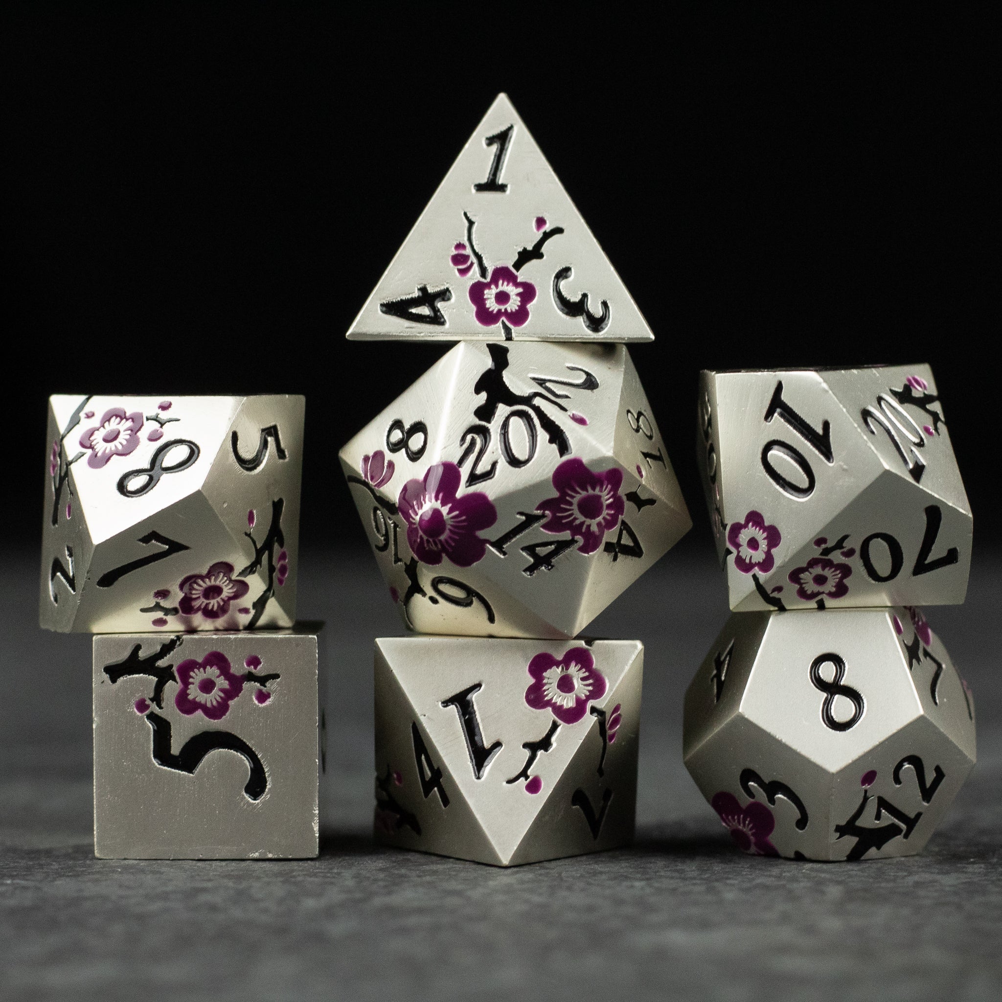 Silver & Maroon Metal Flower Dice - Set of silver metal dice with maroon floral engravings, featuring various polyhedral shapes including d20, d12, d10, d8, d6,