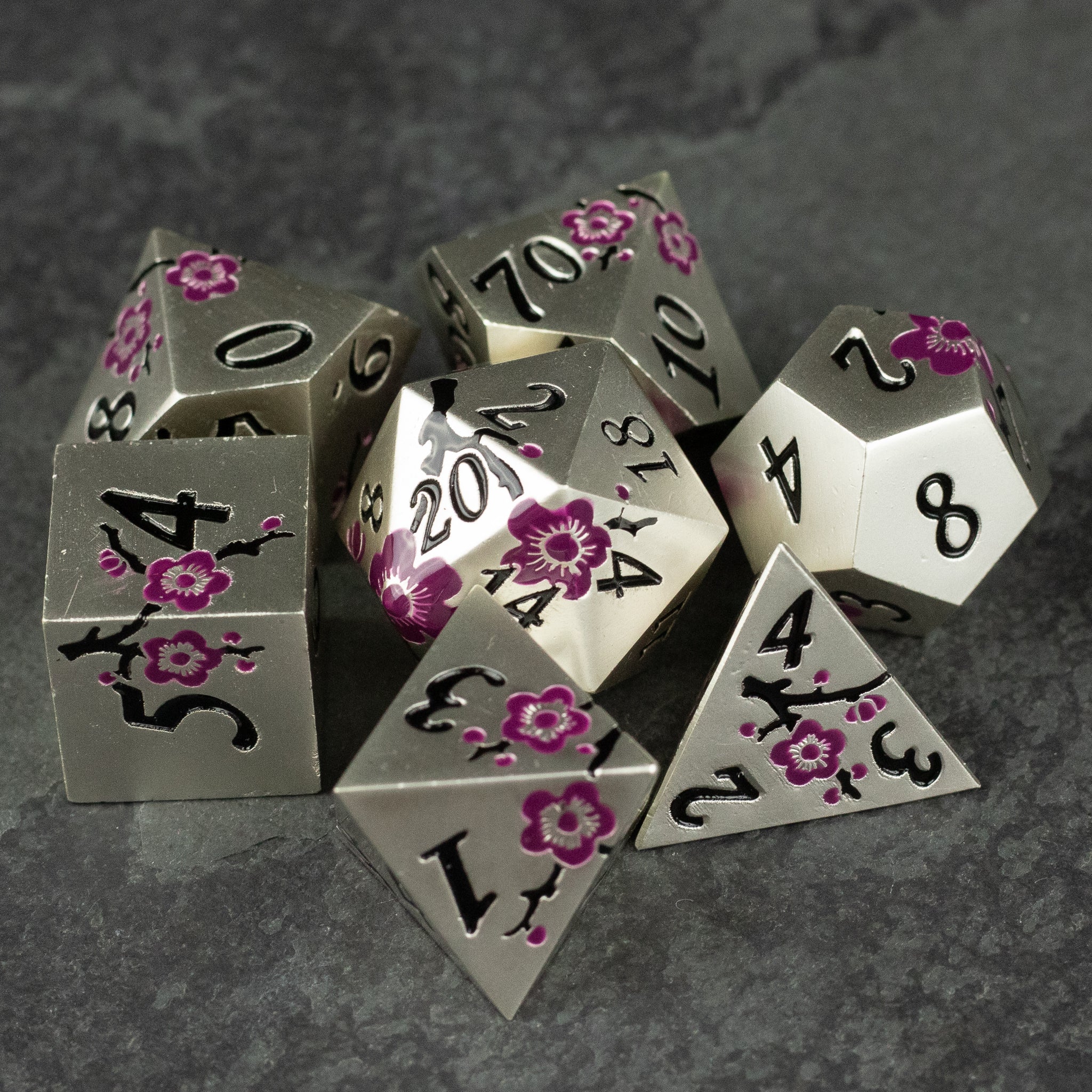 Silver & Maroon Metal Flower Dice - Silver metal polyhedral dice set with maroon floral patterns and black numbers on each face.