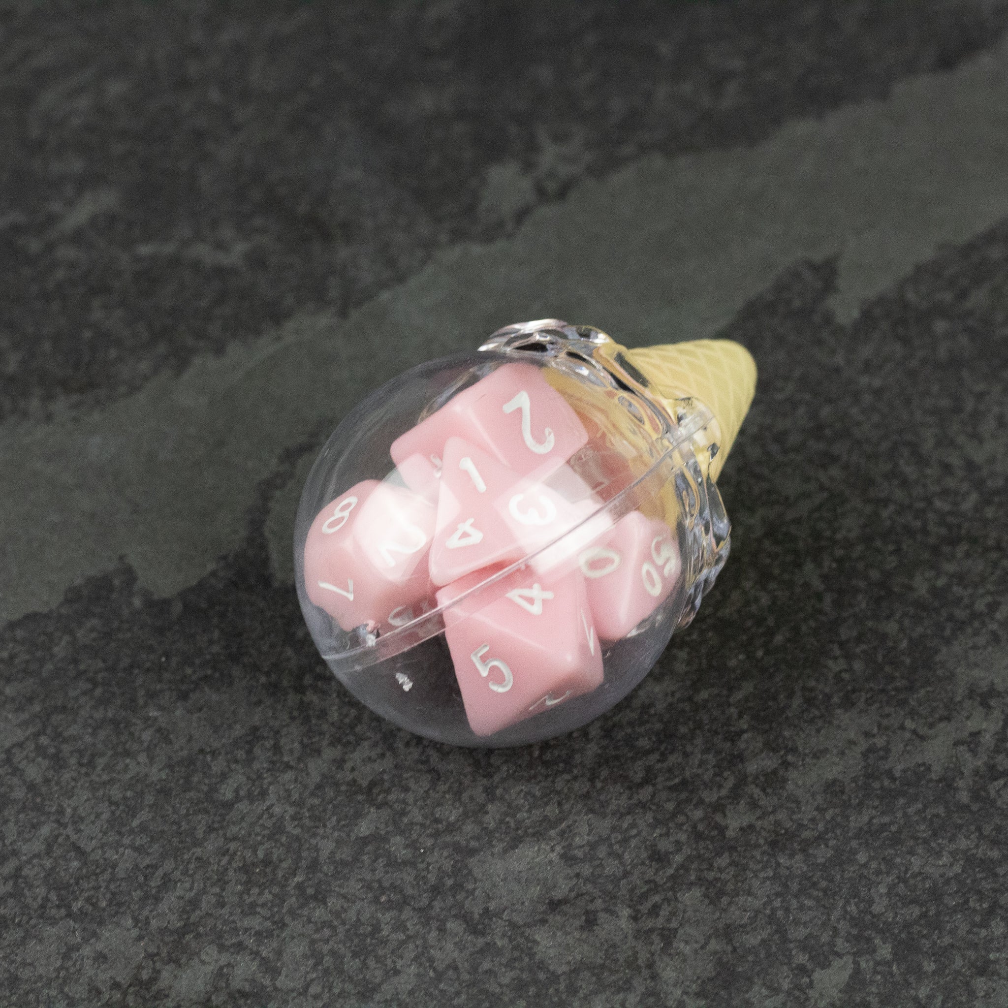 Dice Cream Cones - Clear plastic container shaped like an ice cream cone holding pink polyhedral dice.