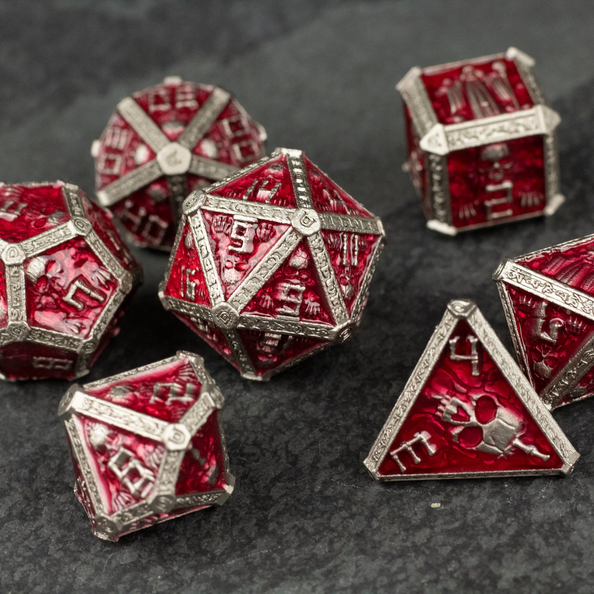 Red Necromancer Metal Dice Set - Red metal necromancer dice set with silver edges and engraved arcane symbols.