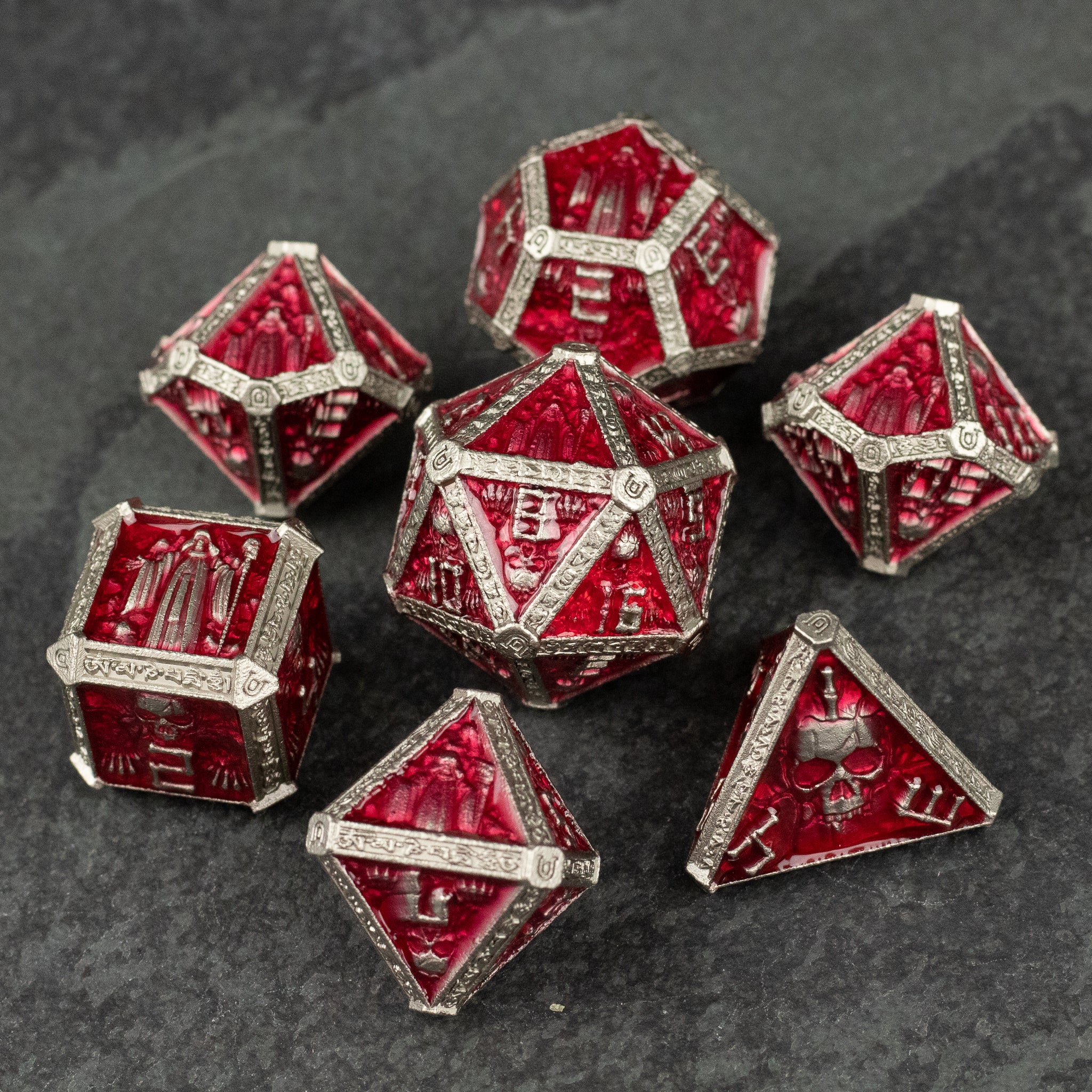 Red Necromancer Metal Dice Set - Red metal necromancer-themed dice set with skull and bone engravings on each face.