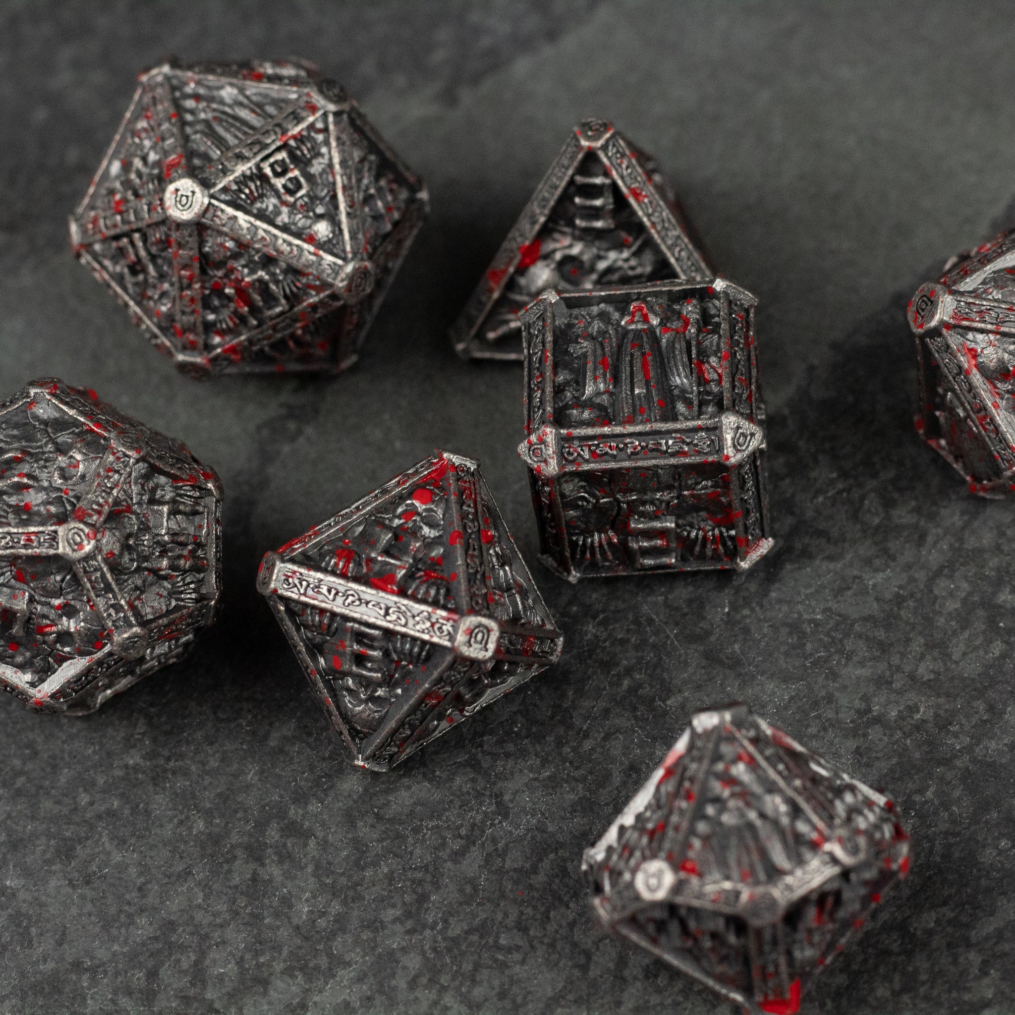 Bloody Necromancer Metal Dice Set - Metal necromancer-themed dice set with intricate designs and red accents on black finish.