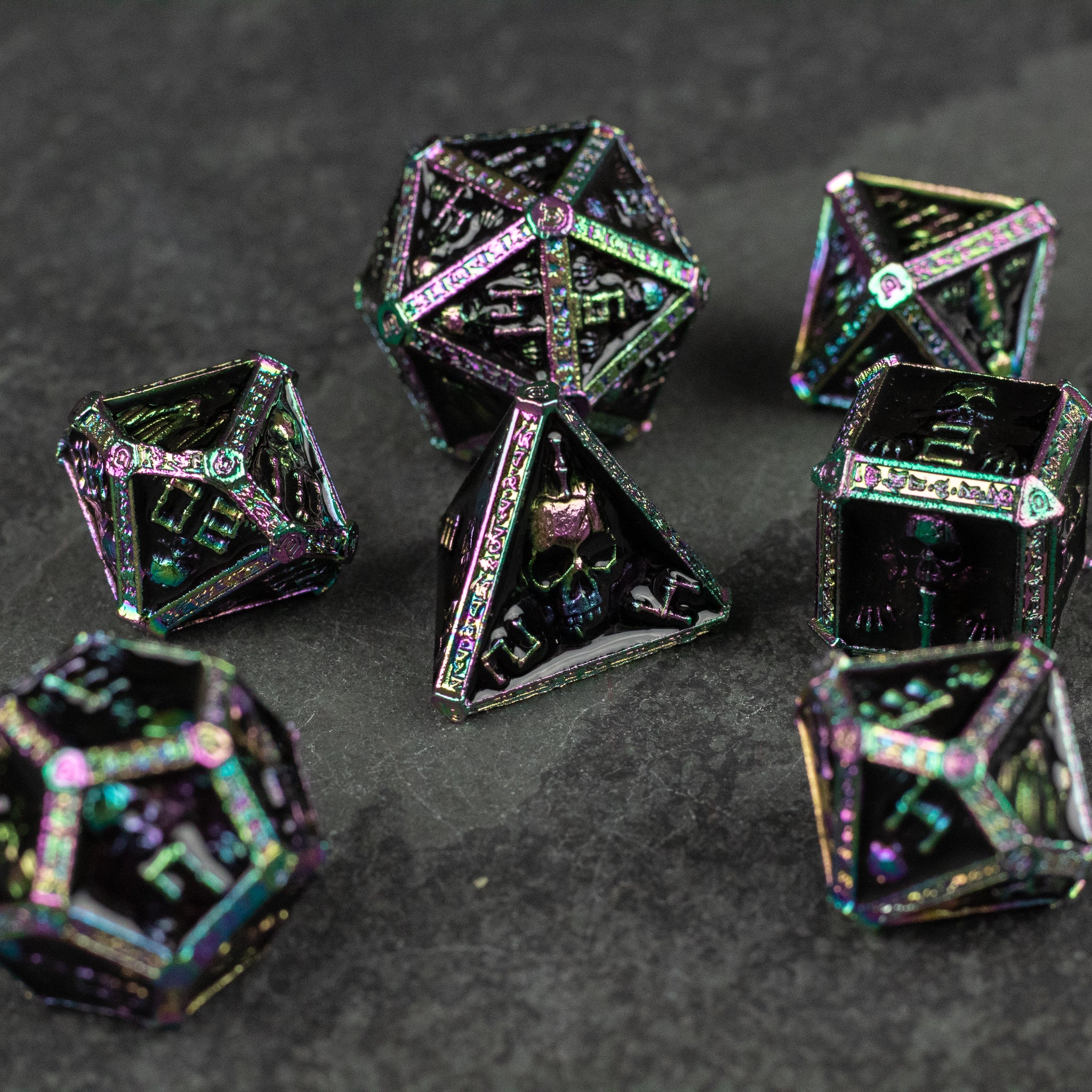 Anodized Necromancer Metal Dice Set - Anodized metal polyhedral dice set with iridescent black finish and glowing, sharp-edged numeric engravings.