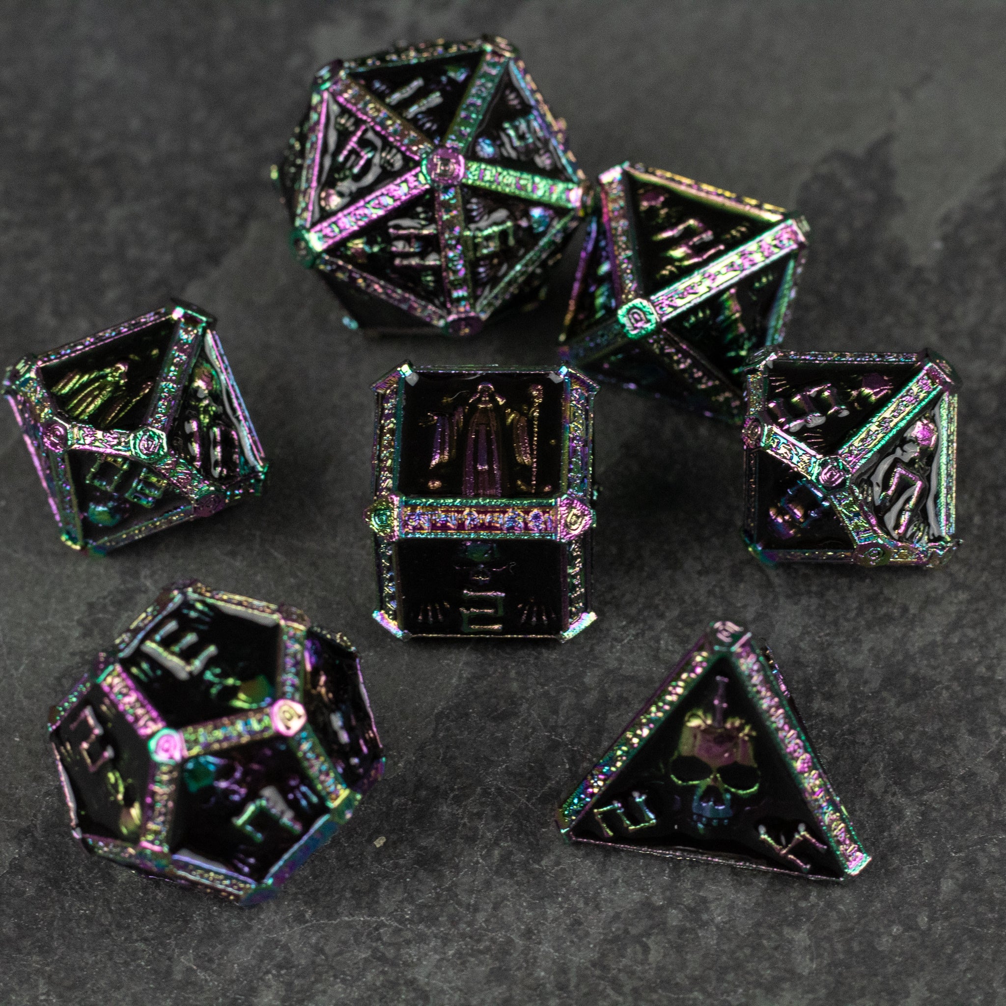 Anodized Necromancer Metal Dice Set - Set of seven black anodized metal dice with iridescent purple and green edges and engraved numbers for tabletop gaming.
