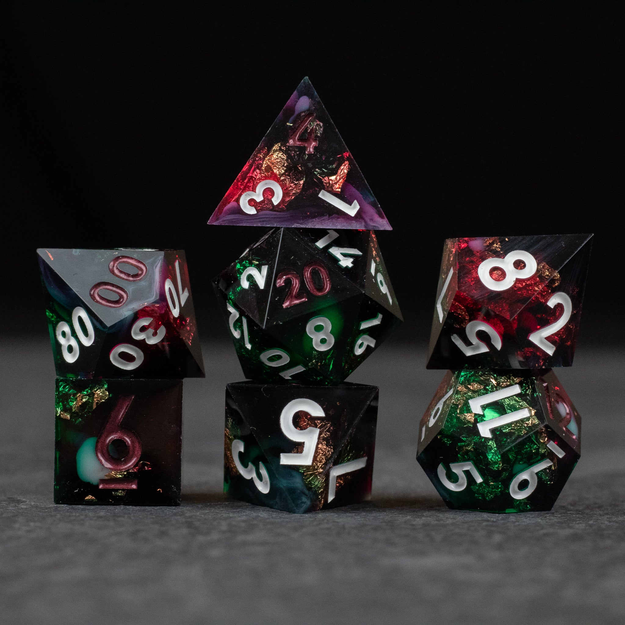Chromatic Aberration Dice Set - Seven polyhedral dice with sharp edges in a chromatic aberration style, featuring mixed vibrant colors and white numbering.