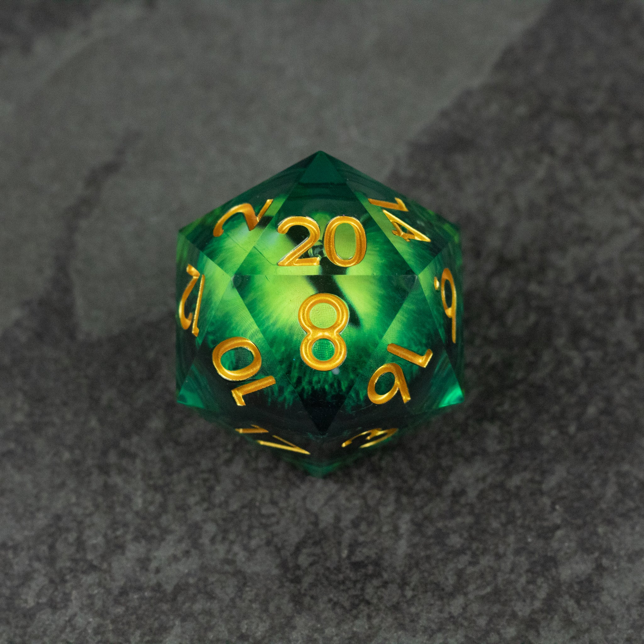 33mm Liquid Floating Eye - Green - Green 33mm 20-sided die with gold numbers and a glossy liquid core effect.