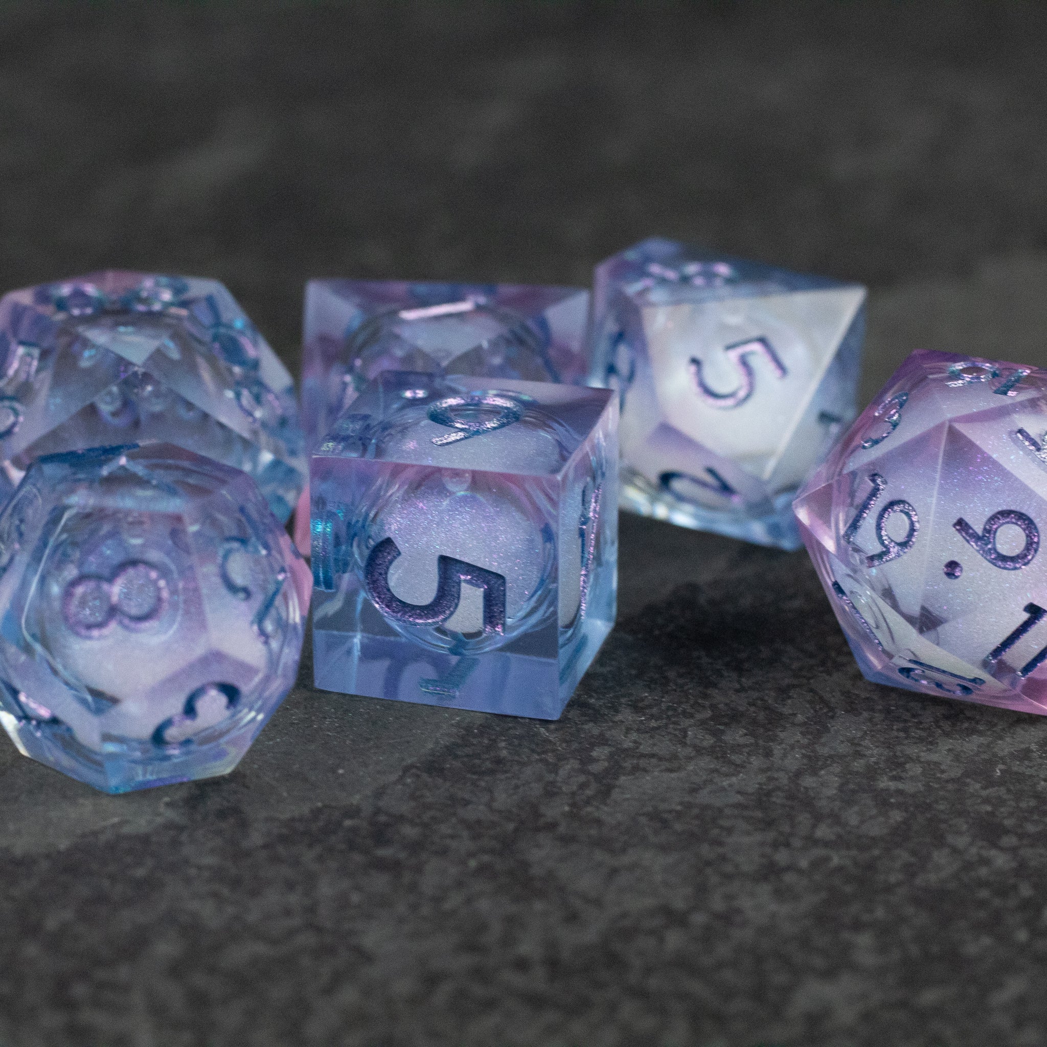 Fae Magic - Liquid Core Dice Set - Translucent purple and blue polyhedral dice set with liquid core and white numbers.