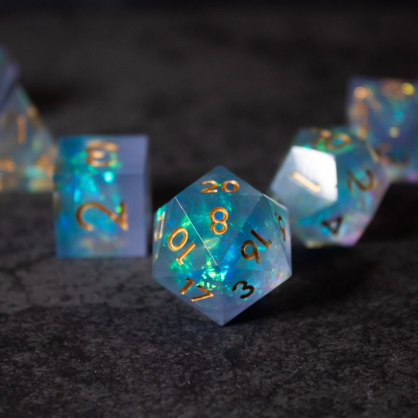Frost Fire - Sharp Edge Opalescent Dice - Opalescent sharp edge 20-sided dice with blue and white frosted colors and gold numbering.