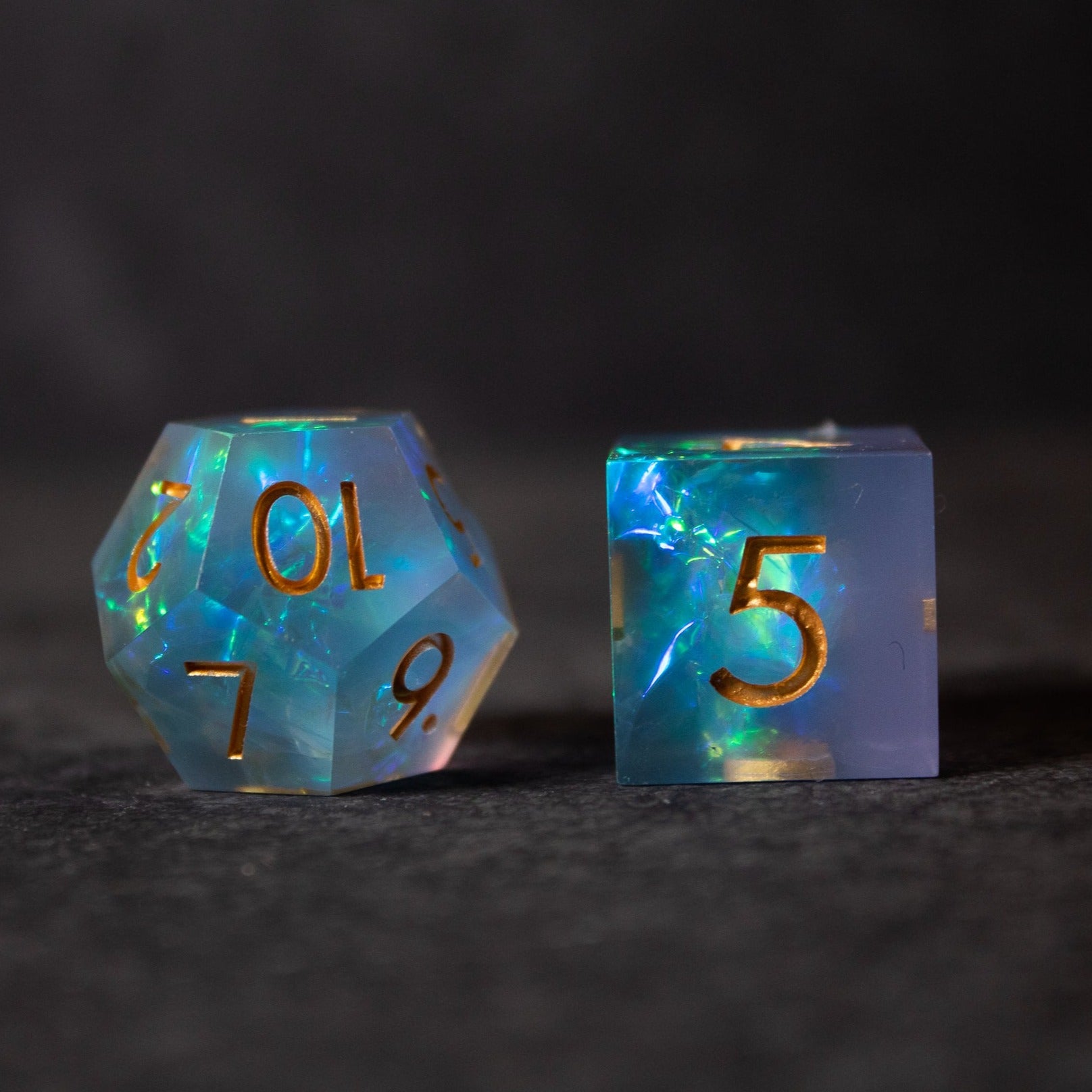 Frost Fire - Sharp Edge Opalescent Dice - Translucent opalescent blue d20 and d6 dice with sharp edges and gold numbers.