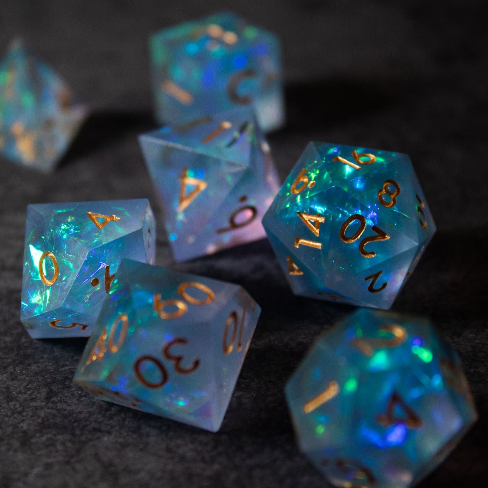 Frost Fire - Sharp Edge Opalescent Dice - Translucent opalescent gaming dice set with sharp edges, glowing blue and green hues, gold numbers.