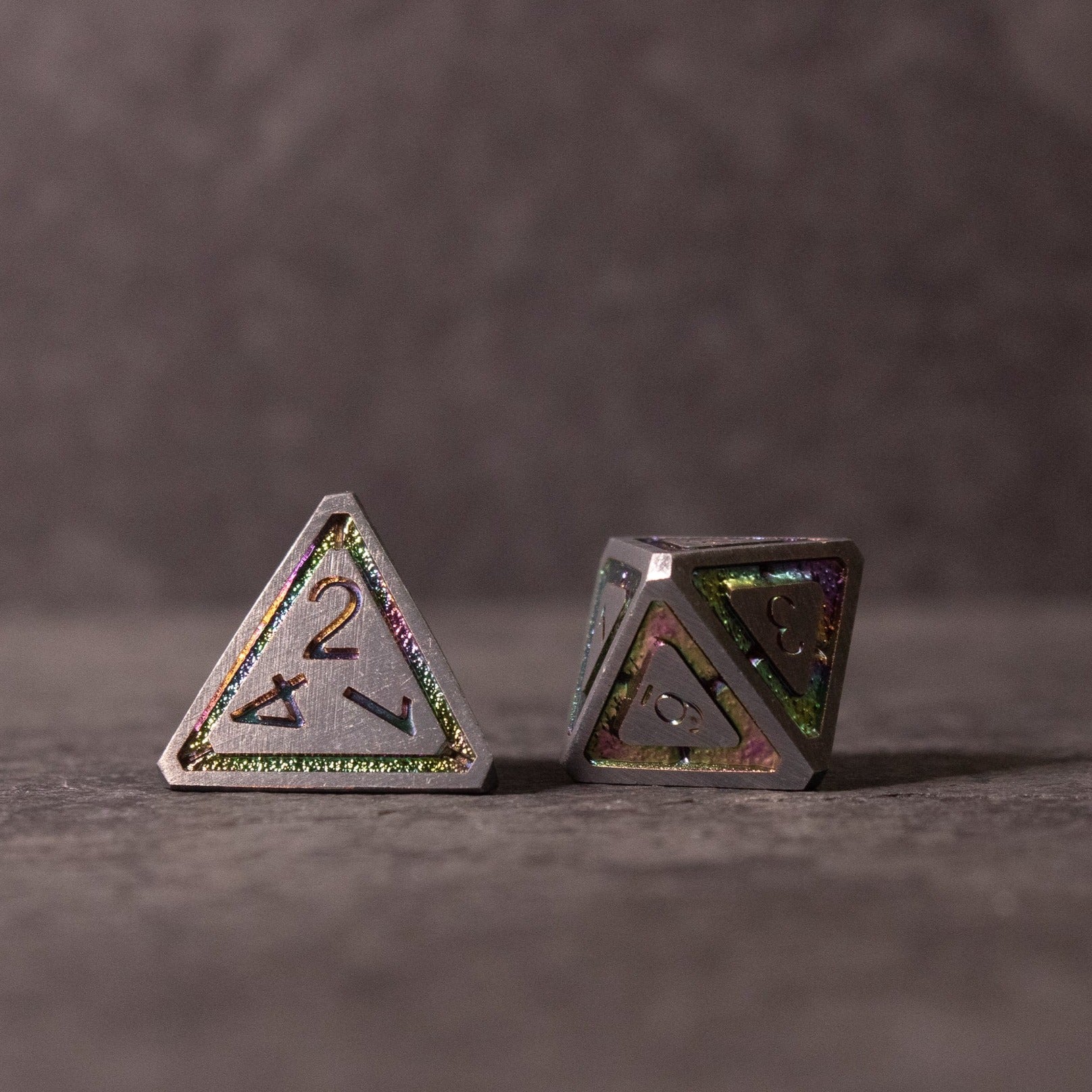 Prismatic Core Dice Set - Metallic prismatic d4 and d8 dice with holographic glitter and sharp edges.