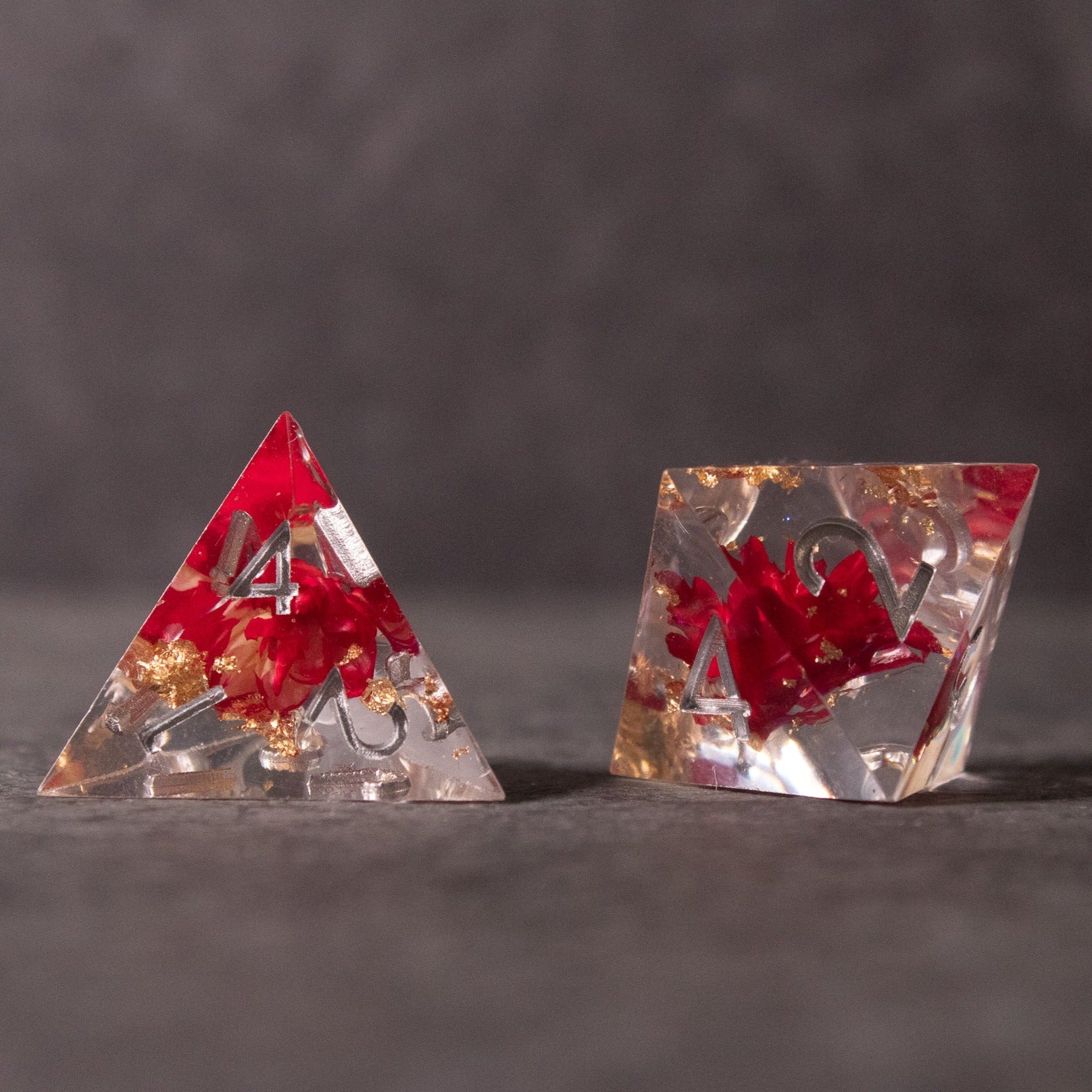 Red Lotus Flower Dice Set - Red sharp-edged dice set with embedded red lotus flowers and gold flakes, clear resin.