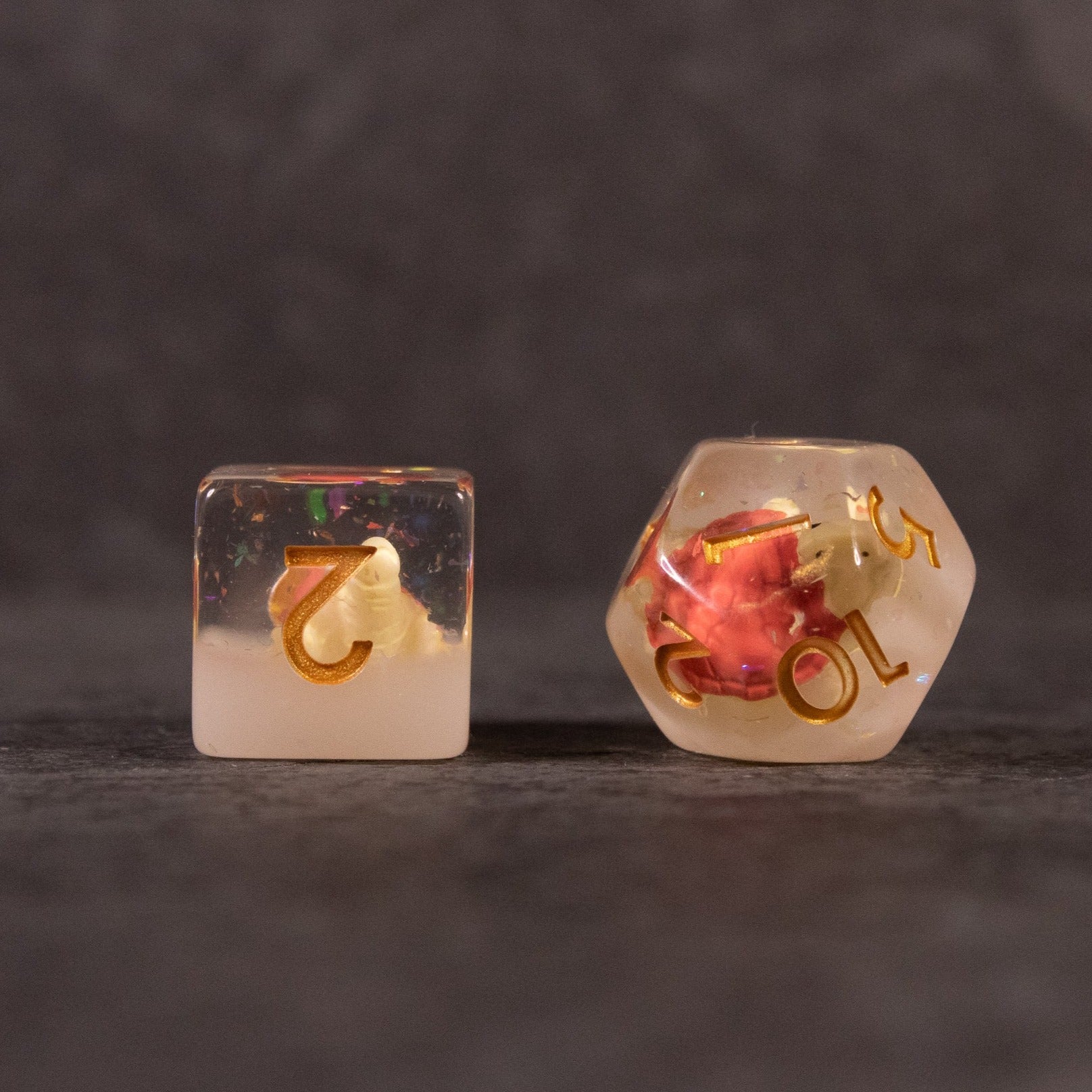 Brown Turtle Dice Set - Brown turtle figurine encapsulated in clear resin 6-sided and 10-sided dice with gold numbers.