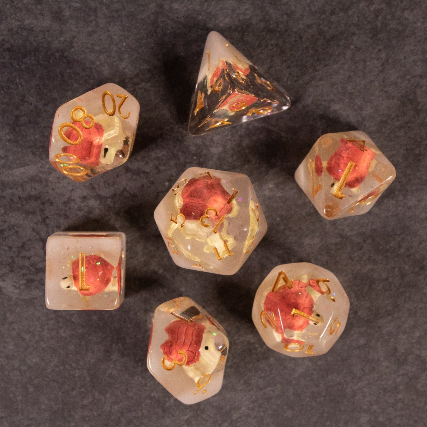 Brown Turtle Dice Set - Brown translucent polyhedral dice set with small red turtle figurines encased inside each die.