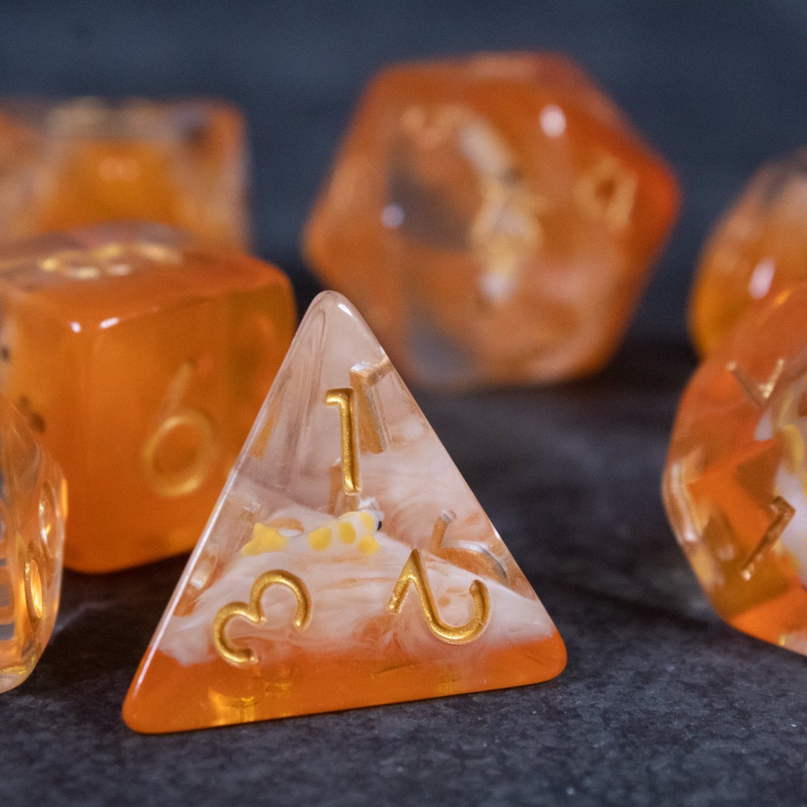 Orange Koi Fish Dice Set - Orange and clear resin dice set with gold numbering, featuring a koi fish design inside the dice.