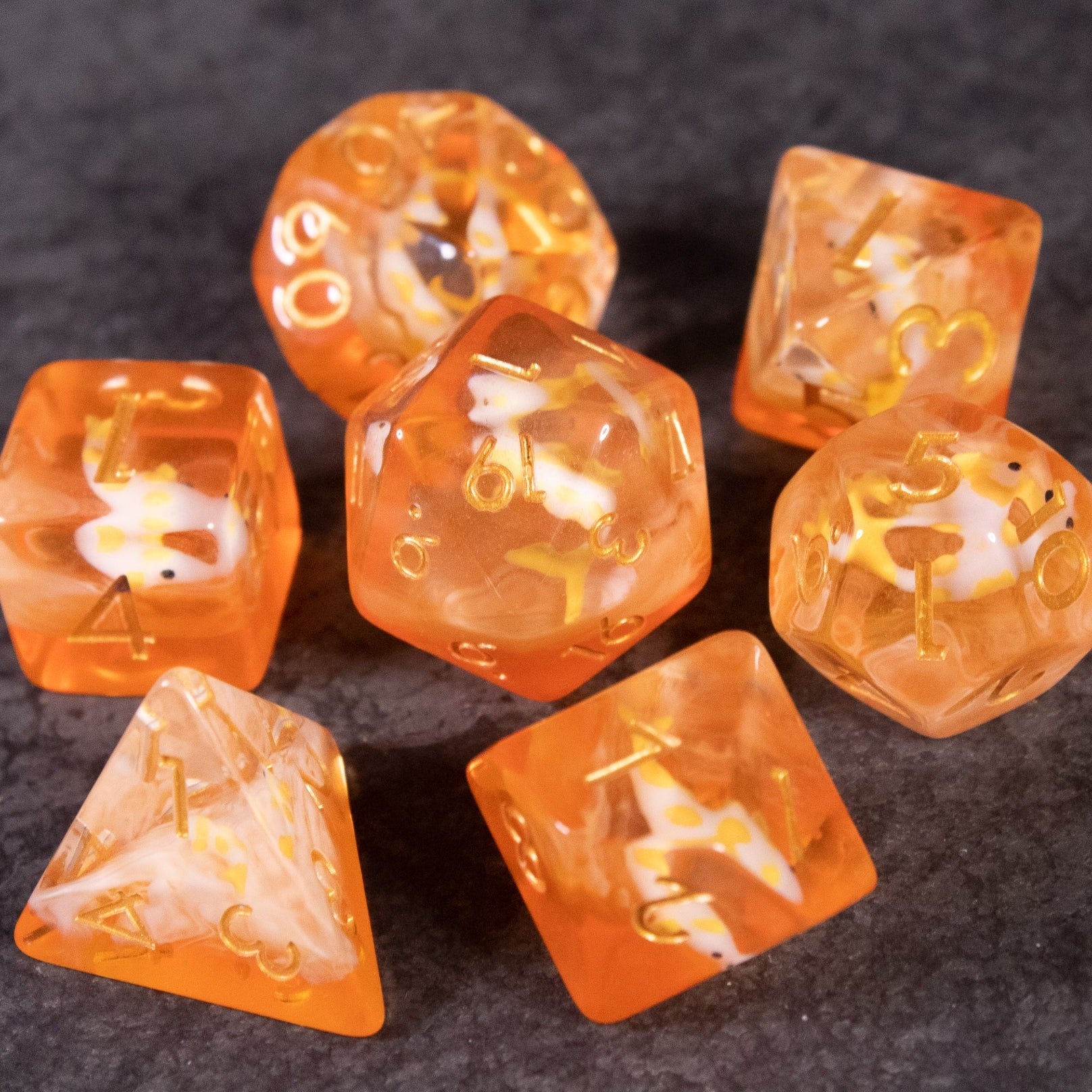 Orange Koi Fish Dice Set - Translucent orange dice set featuring embedded koi fish and gold numbering.