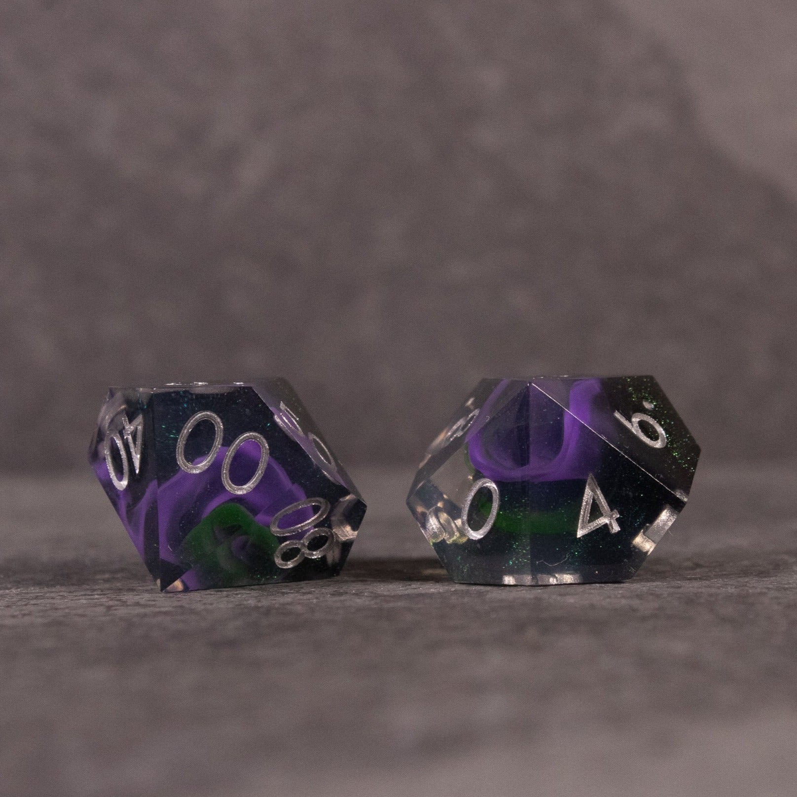 Witch's Brew Dice Set - Sharp-edged d20 dice with swirling green and purple colors and white numbering.