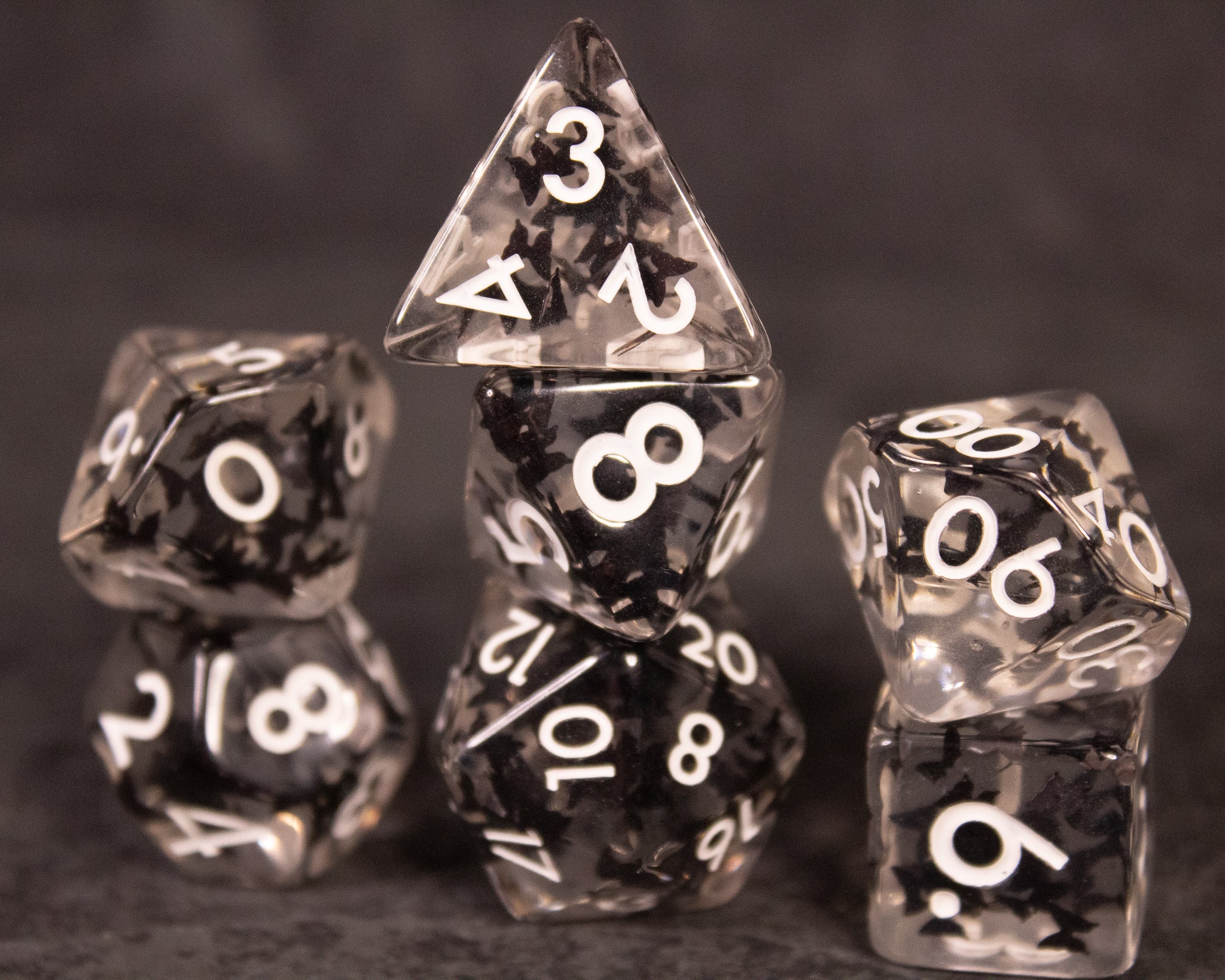 Black Butterfly Dice Set - Black translucent polyhedral dice set with white numbers and butterfly-shaped inclusions.