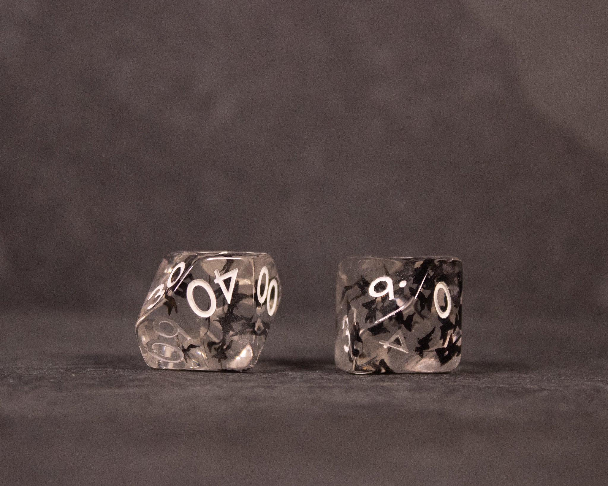 Black Butterfly Dice Set - Black translucent dice with white numbering, featuring butterfly wing inclusions inside each piece.