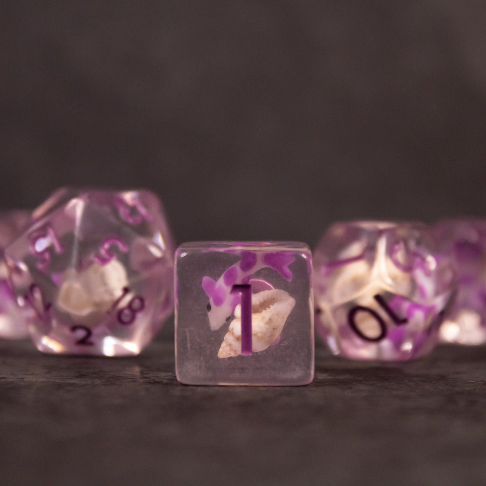 Purple Koi Fish and Seashell Dice Set - Purple translucent dice set featuring embedded koi fish and seashell details with black numbering.