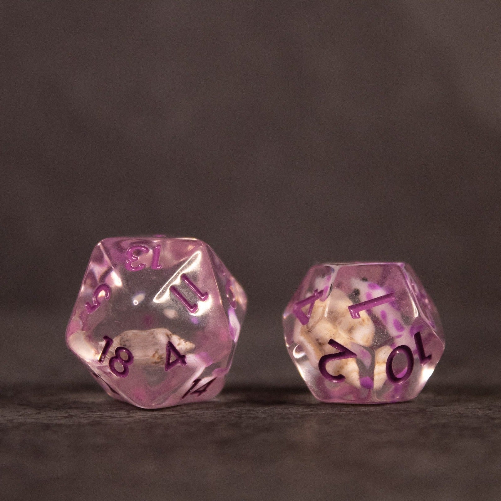 Purple Koi Fish and Seashell Dice Set - Translucent purple 20-sided dice with koi fish and seashell designs, black numbers.