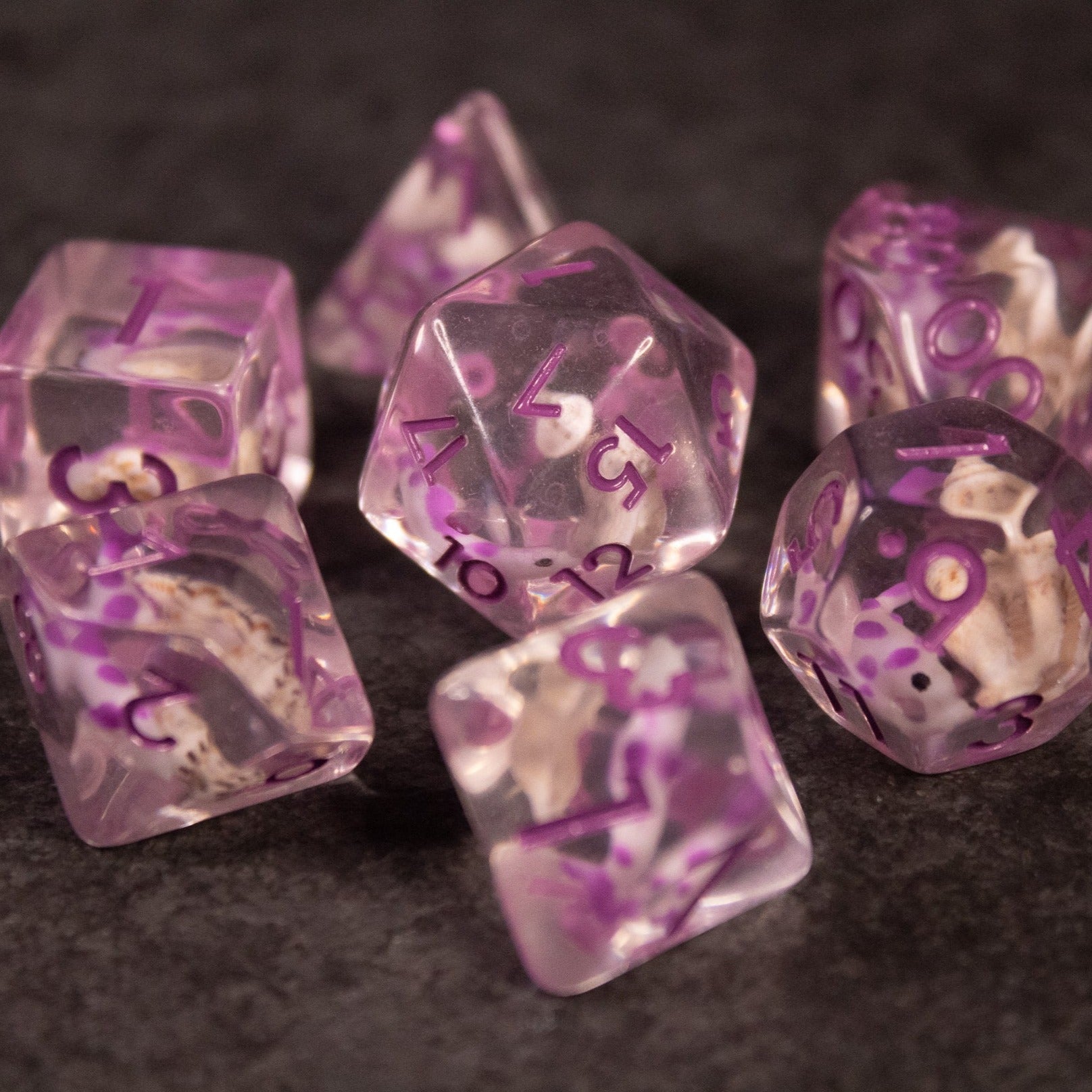 Purple Koi Fish and Seashell Dice Set - Translucent purple polyhedral dice set with koi fish and seashell designs inside.