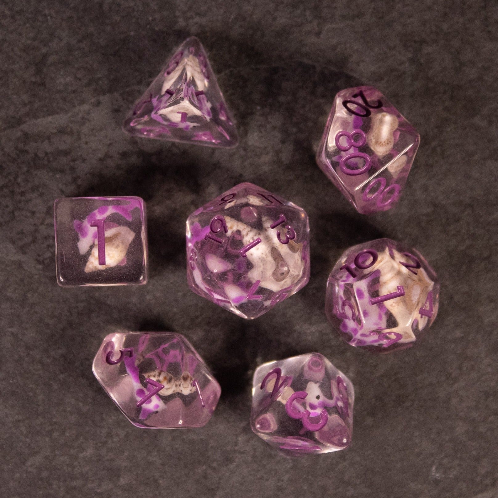 Purple Koi Fish and Seashell Dice Set - Purple translucent polyhedral dice set featuring embedded koi fish and seashells with black numbering.