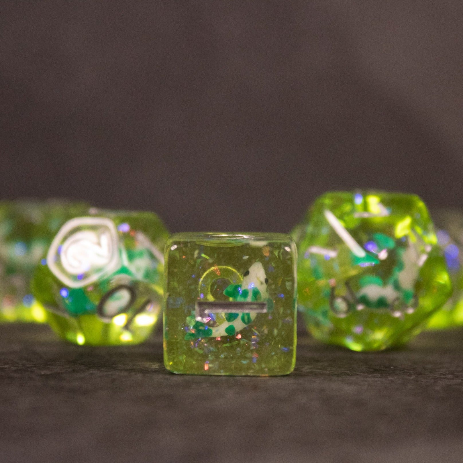 Green Koi Fish Dice Set - Transparent green dice set with embedded koi fish and glitter inclusions, showing various shapes and numbers.