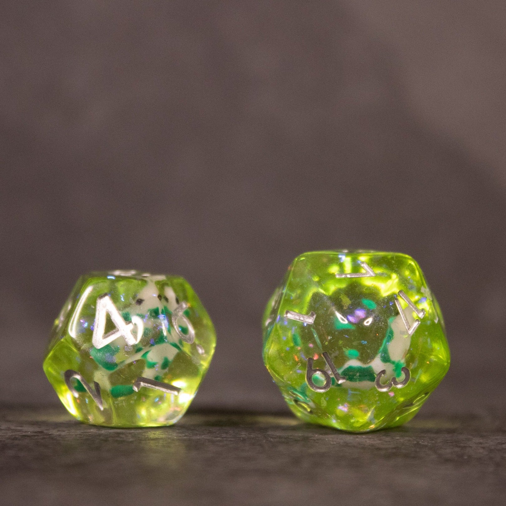 Green Koi Fish Dice Set - Translucent green 12-sided and 20-sided dice with embedded koi fish and blue-green inclusions.