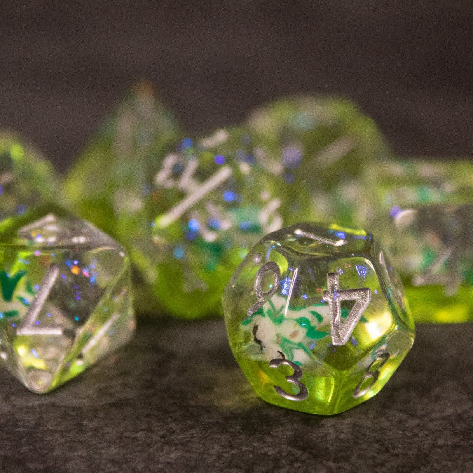 Green Koi Fish Dice Set - Green translucent 20-sided dice with embedded koi fish and silver numbering.