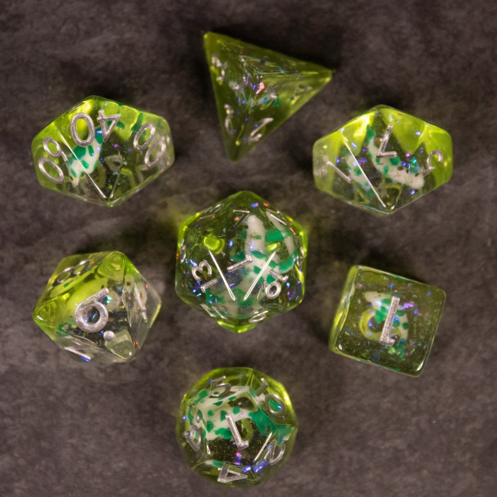 Green Koi Fish Dice Set - Green translucent polyhedral dice set with embedded koi fish inclusions and white numbering.